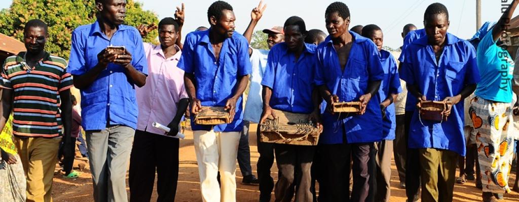 Men play &quot;Akongo&quot;, a traditional music instrument for the Teso people in Serere